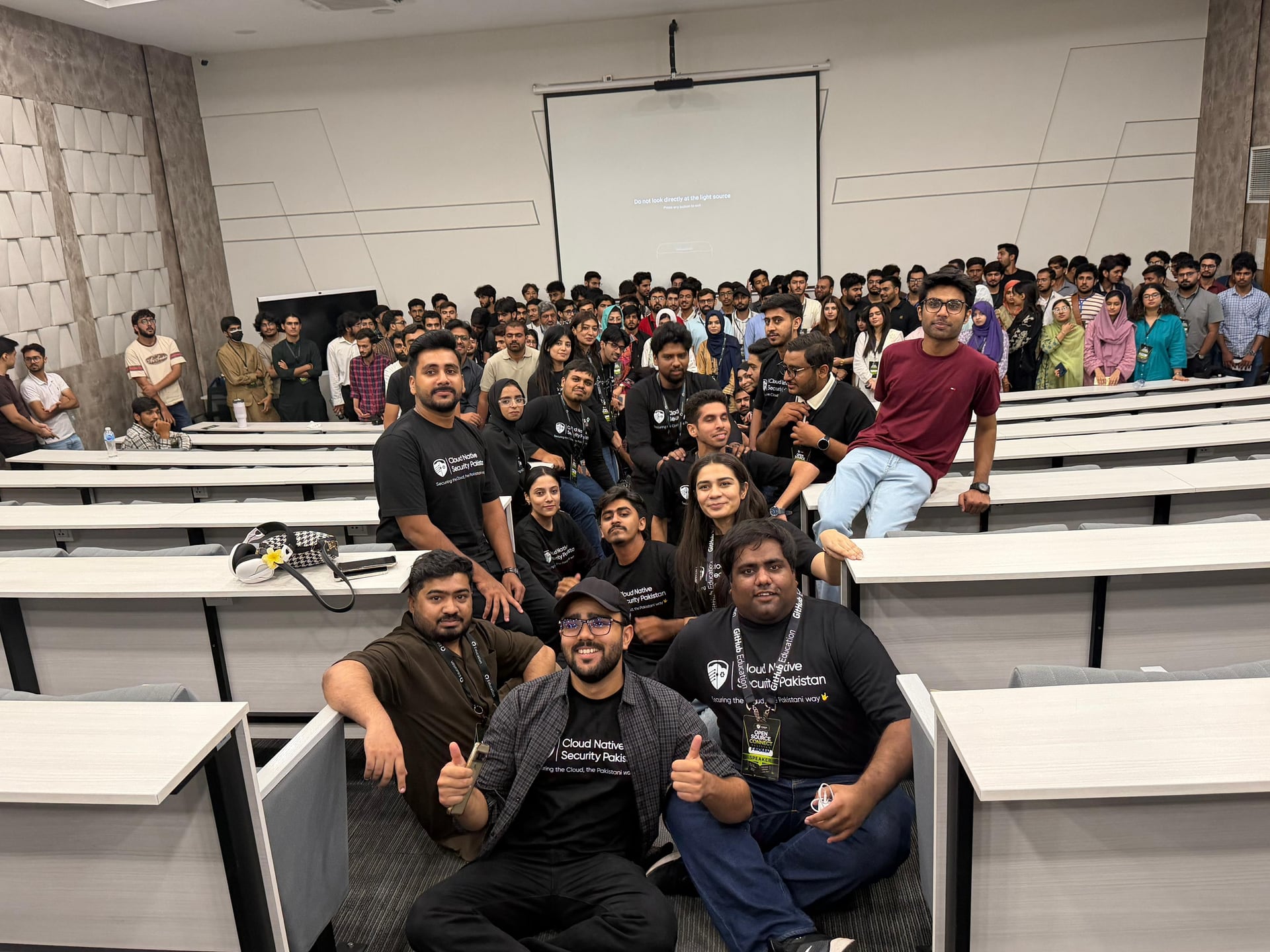 The Open Source Connect Pakistan community gathered in the lecture hall Attendees and organizers gather for a group photo in the lecture hall